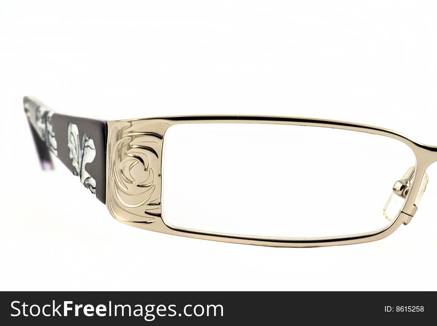 Close up at woman's glasses' lens on a white background. Close up at woman's glasses' lens on a white background