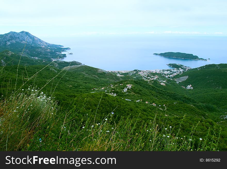 Bird-eye view on coastline and town in highlands