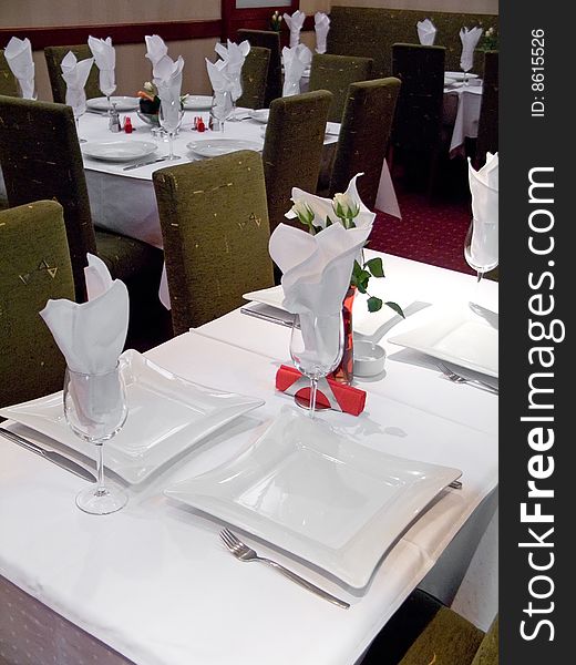 Table with cutlery, plaits and glasses in Restaurant. Table with cutlery, plaits and glasses in Restaurant