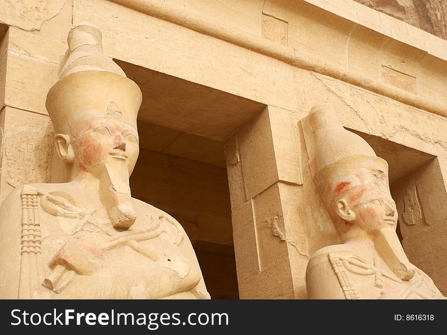Tow statues on queen Hatshepsut in a form of a man at her temple in luxor
