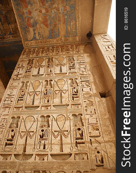 A wall full of Hieroglyphs in Habu temple luxor