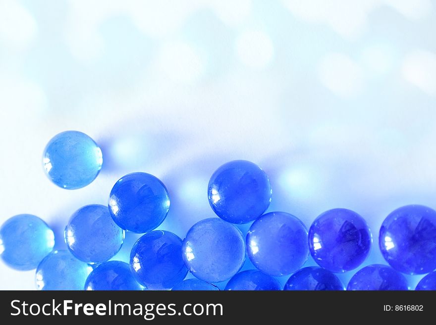 Blue glass balls on a white background