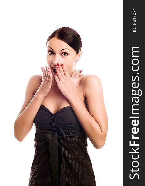 Isolated portrait shot of a beautiful caucasian woman. Holding her face in astonishment.