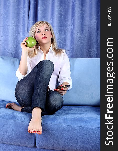 Girl with apple and phone in room