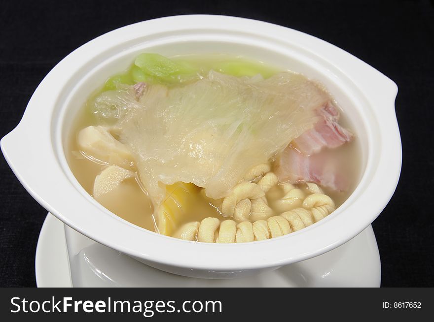 Hot soup on a black table