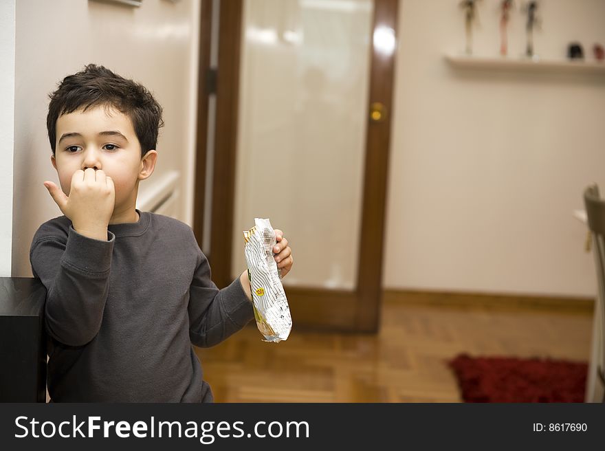 Young boy eating junk food. Young boy eating junk food