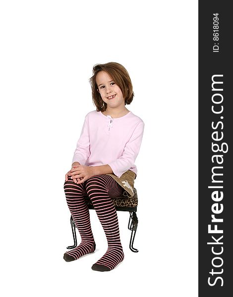 Young Girl In Funky Outfit Sitting On Stool