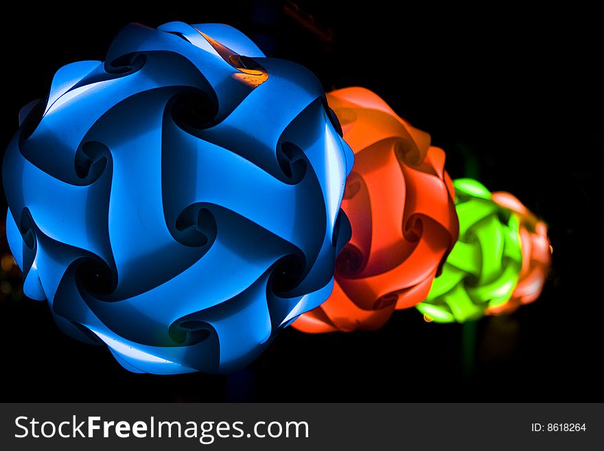 Paper multicolor lanterns at night on black background. Paper multicolor lanterns at night on black background