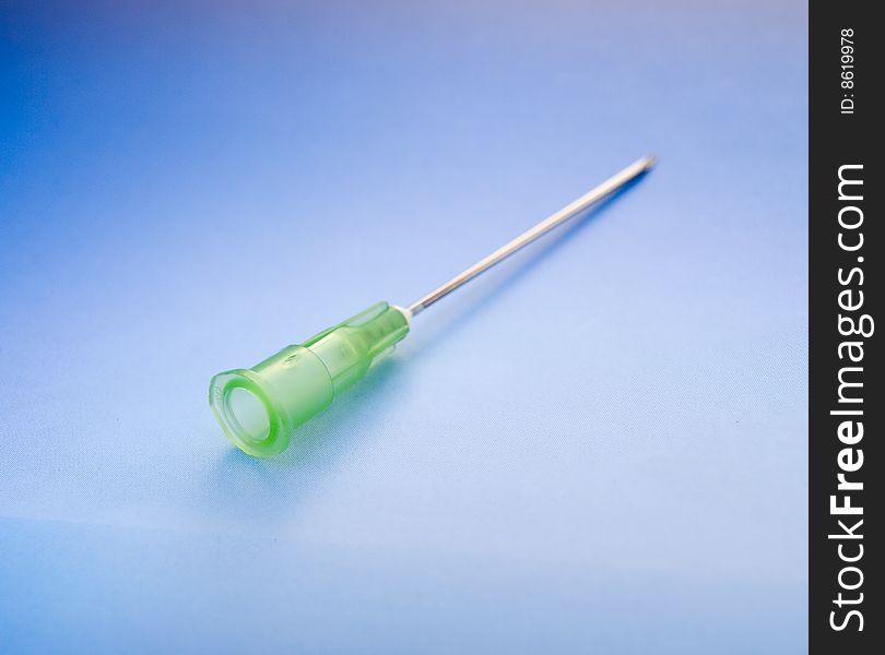 Needle for injection of the blue background