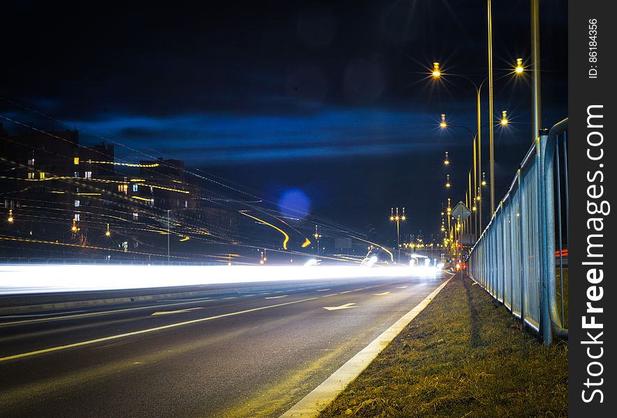 Blur of car headlights on urban streets at night. Blur of car headlights on urban streets at night.