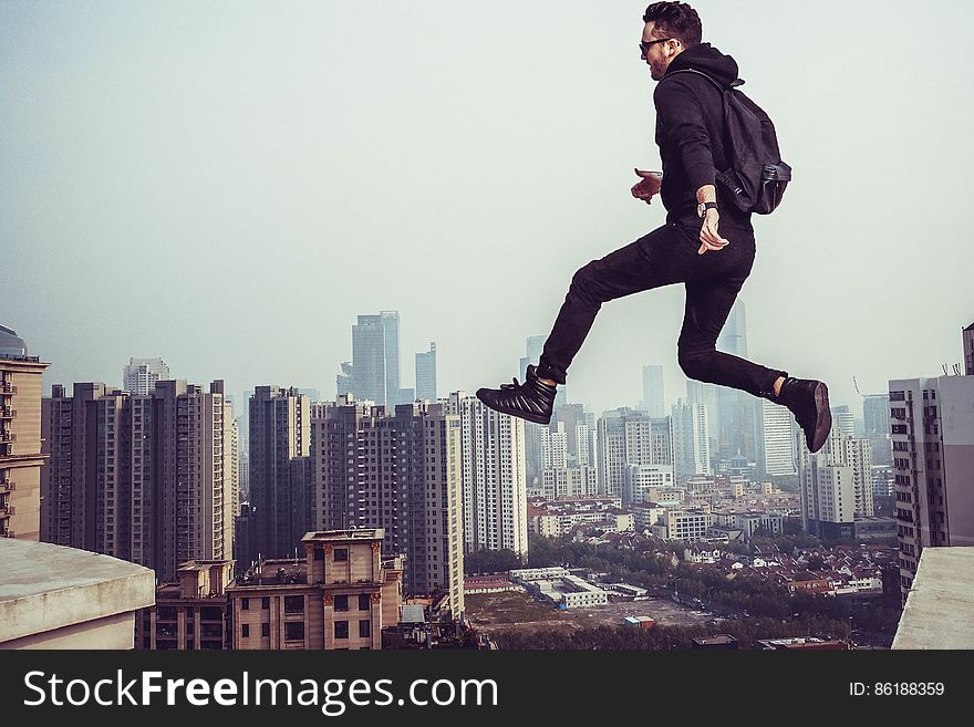 Man Jumping in City