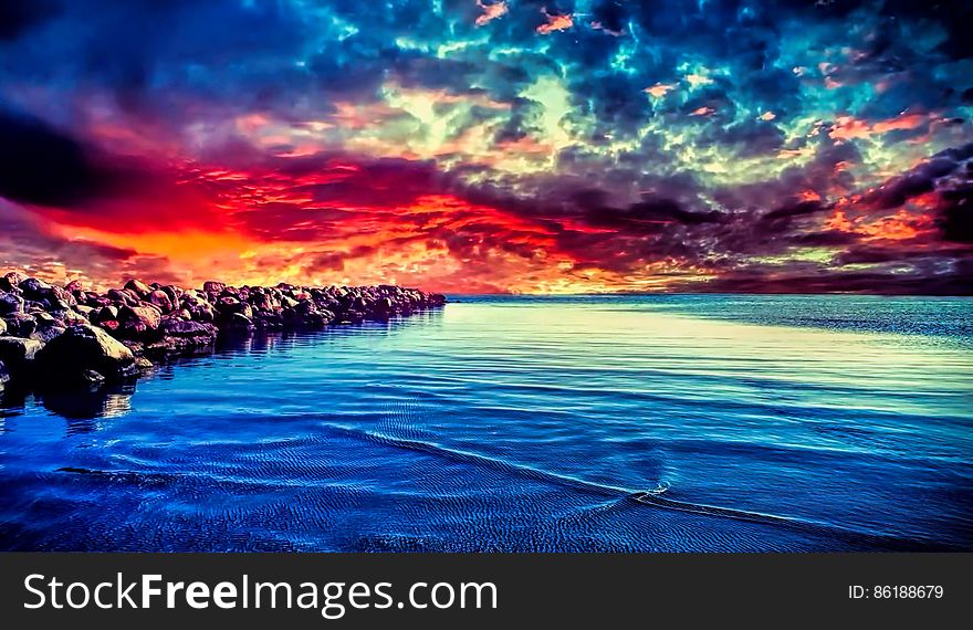 Scenic View Of Sea Against Dramatic Sky