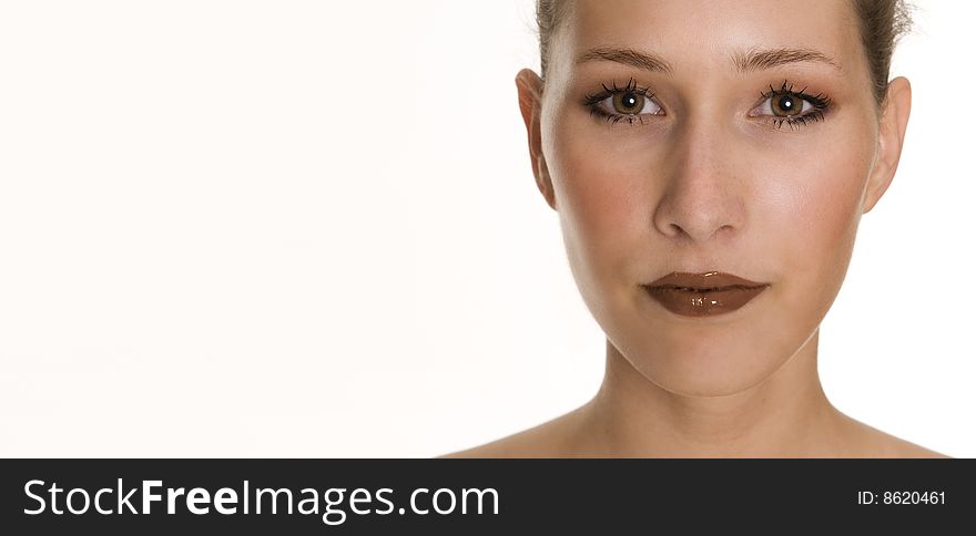 Pretty womans face with liquid chocolate as lipgloss. Pretty womans face with liquid chocolate as lipgloss