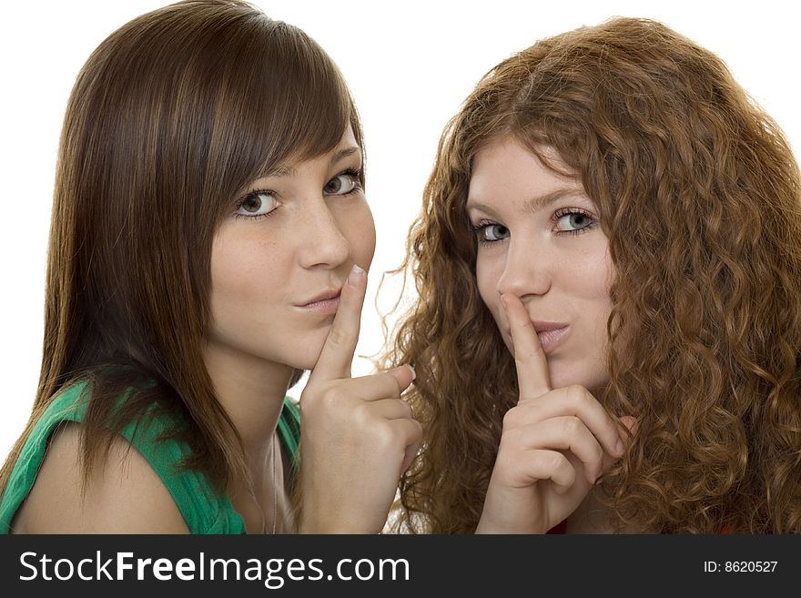 Two teenager with gestures quiet, a finger in front of the mouth
