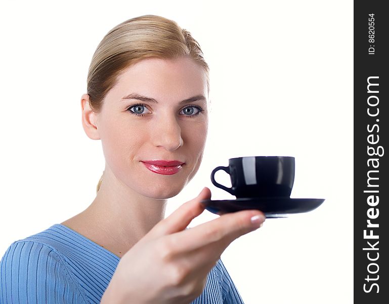 The beautiful girl with a coffee cup in a hand