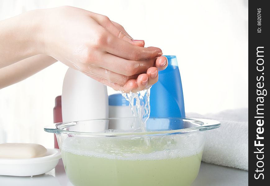 Foam of soap and female hands. Foam of soap and female hands