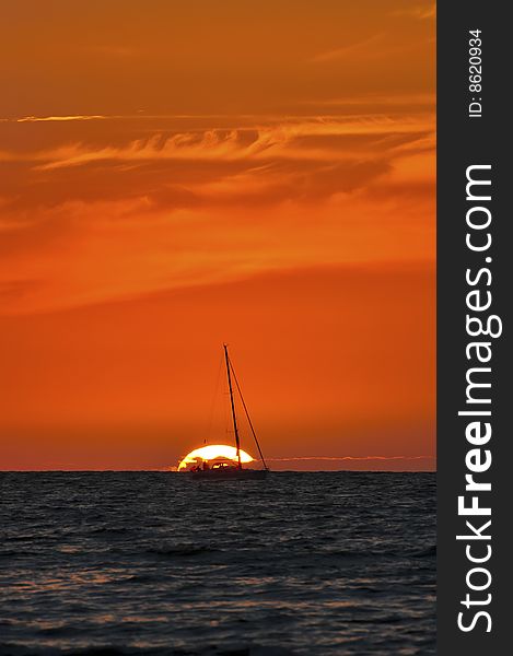 Sunset and silhouette of sailing boat. Sunset and silhouette of sailing boat