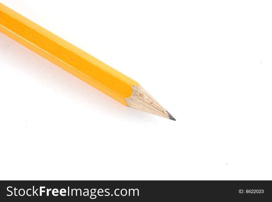 The yellow pencil on a white background