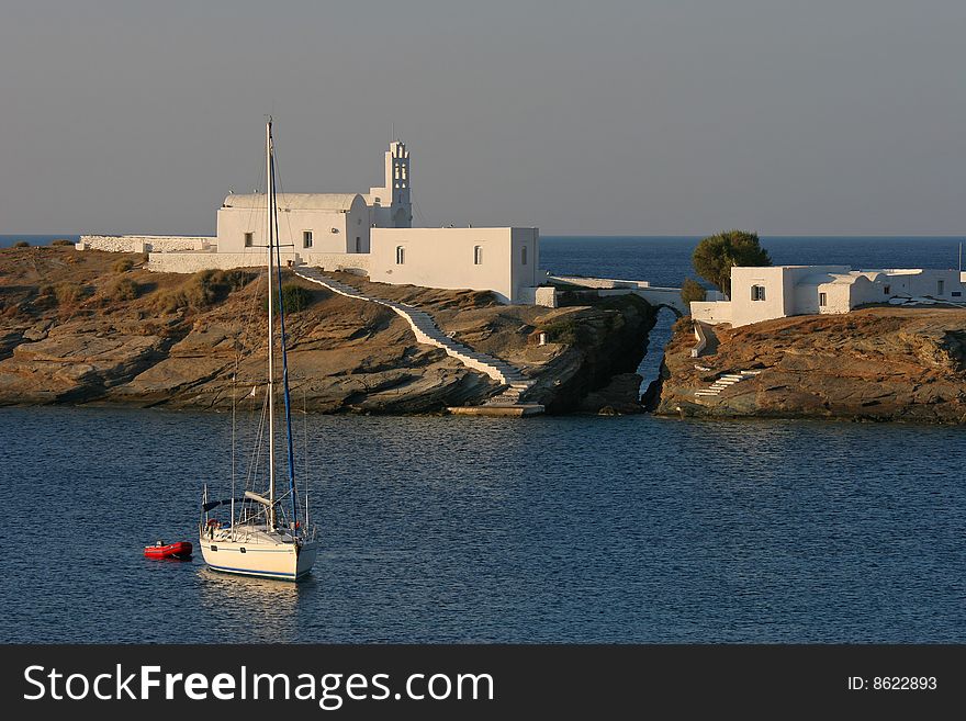 Seascape with the boat and greek style architecture