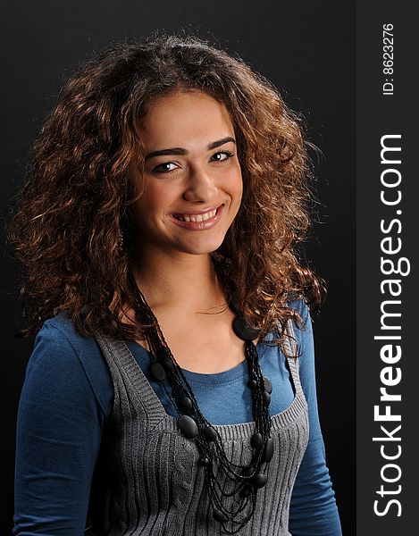 Young beautiful woman's portrait
over black