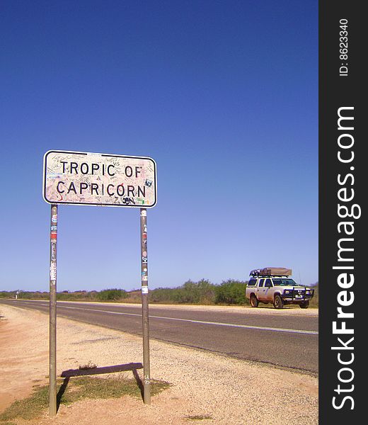 Tropic of Capricorn sign with 4WD in the background.  Taken in Western Australia