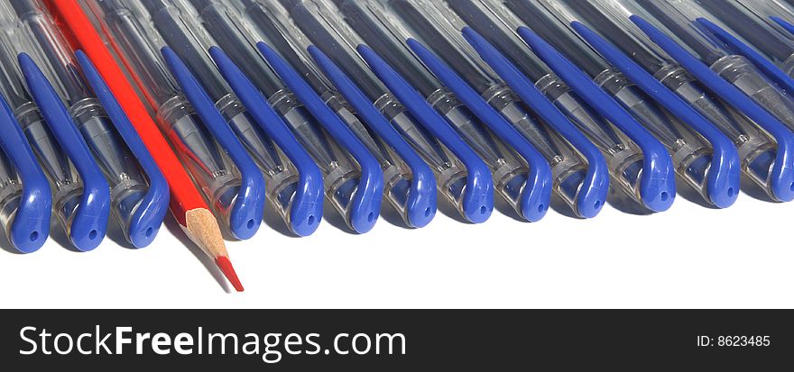 Many writing handles of dark blue color and one red pencil. Many writing handles of dark blue color and one red pencil.