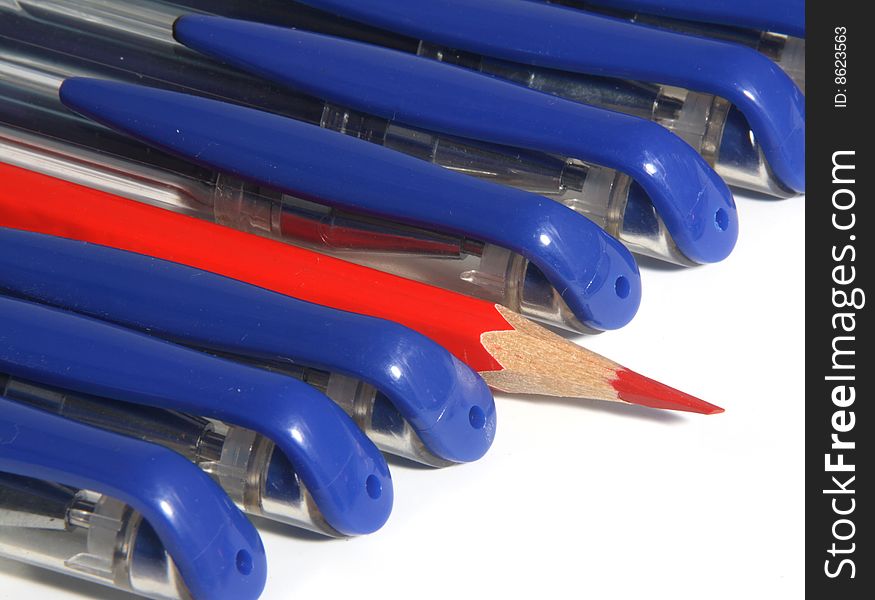 Many writing handles of dark blue color and one red pencil. Many writing handles of dark blue color and one red pencil.