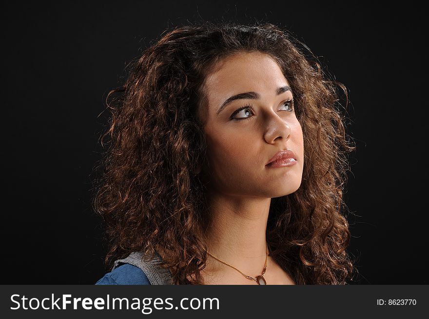 Young beautiful woman's portrait
over black