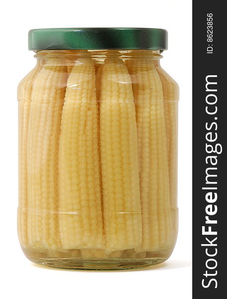 Closeup of pickled baby corns in jar