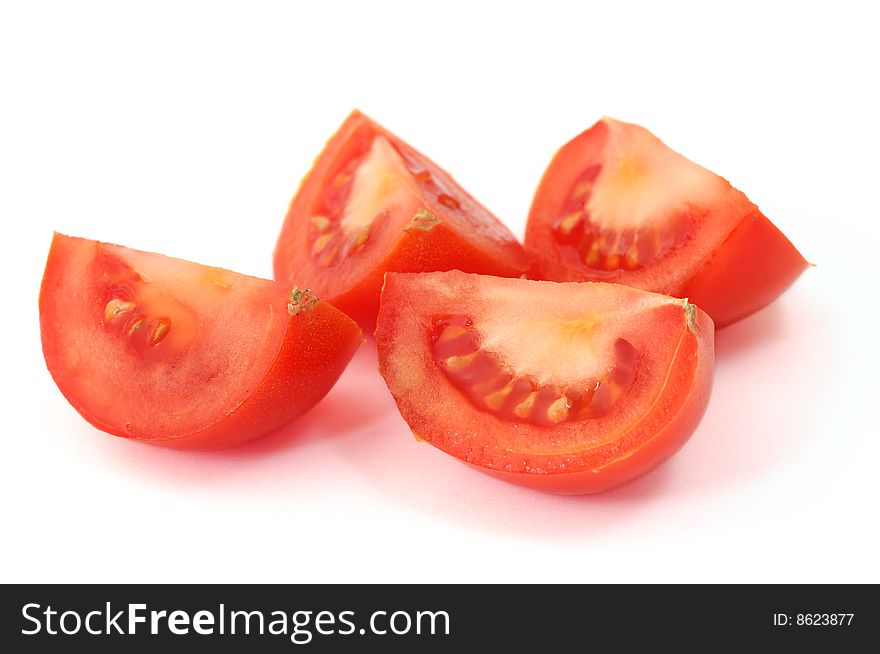 Isolated tomato slices on white background