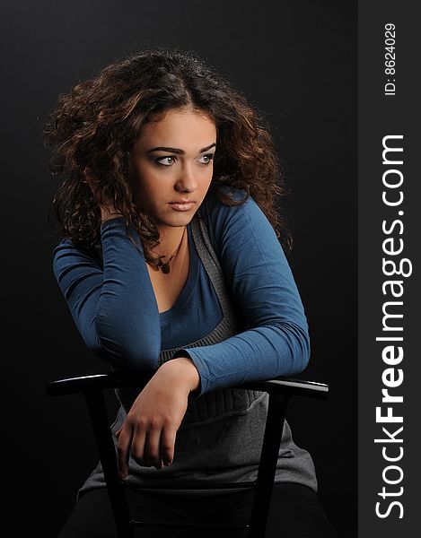 Beautiful model with curly hair over black