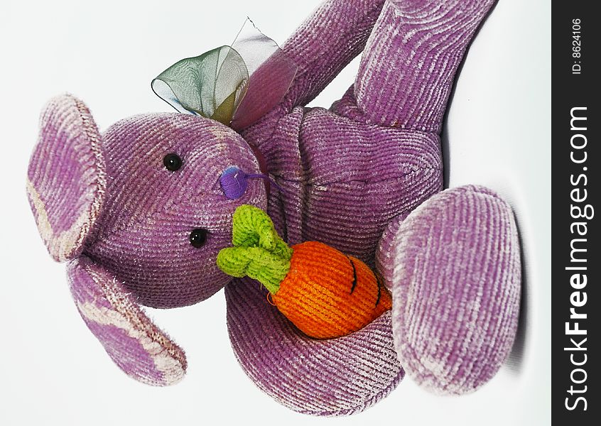 Tired and worn purple toy bunny. Tired and worn purple toy bunny