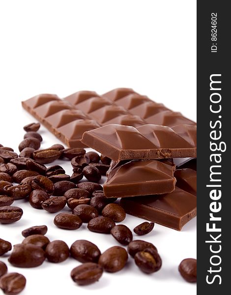 Chocolate and coffee beans on white background