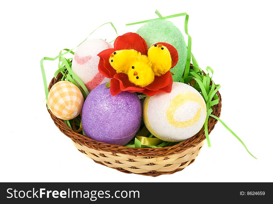 Easter basket with eggs and little chicken in a flower isolated on white background,check also Flowers. Easter basket with eggs and little chicken in a flower isolated on white background,check also Flowers