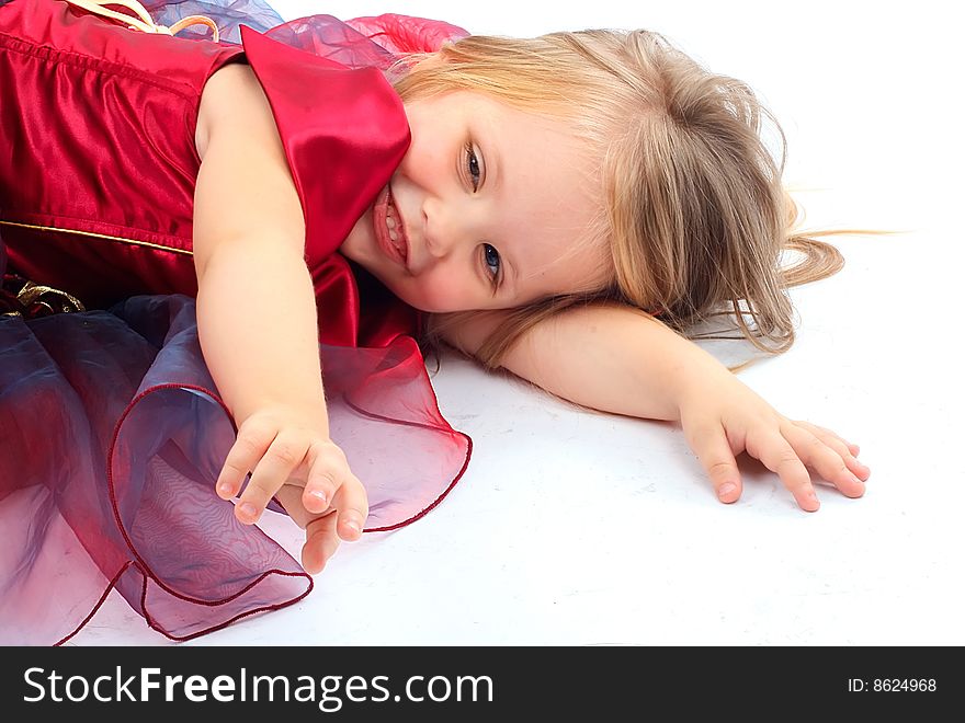 Portrait of the beautiful girl in a red dress