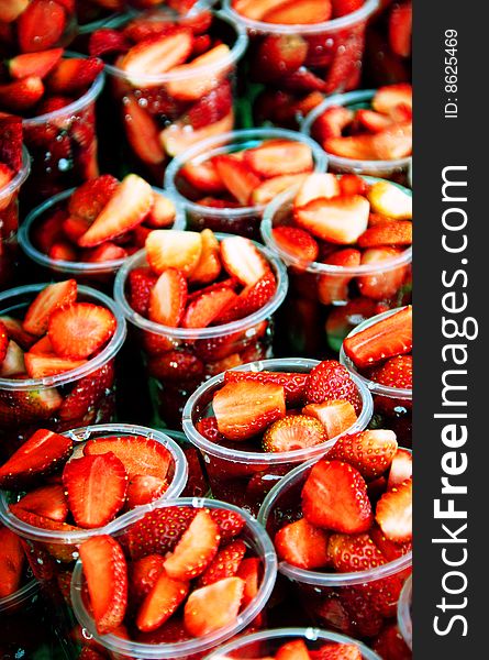 Fresh cut strawberries in cups