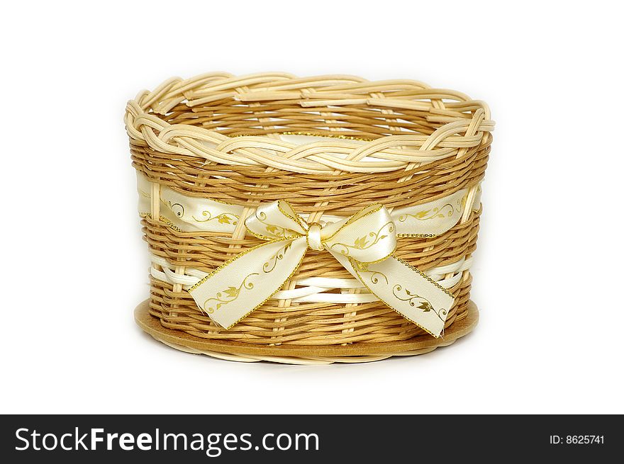 A wicker basket with textile bow home decoration