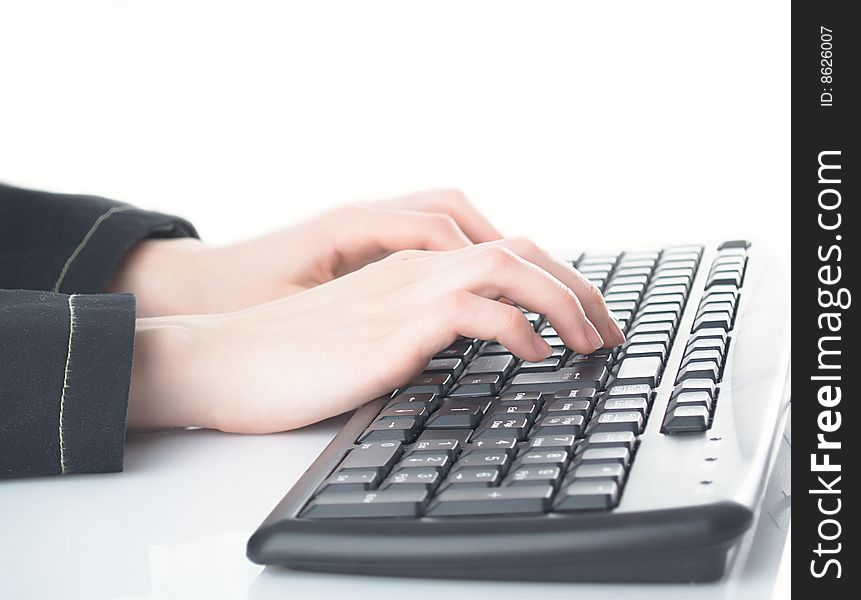 Girl hands typing on the background. Girl hands typing on the background