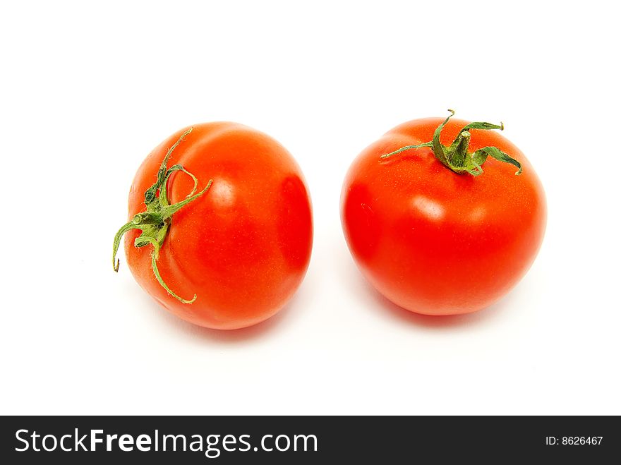 Red tomatos isolated on white