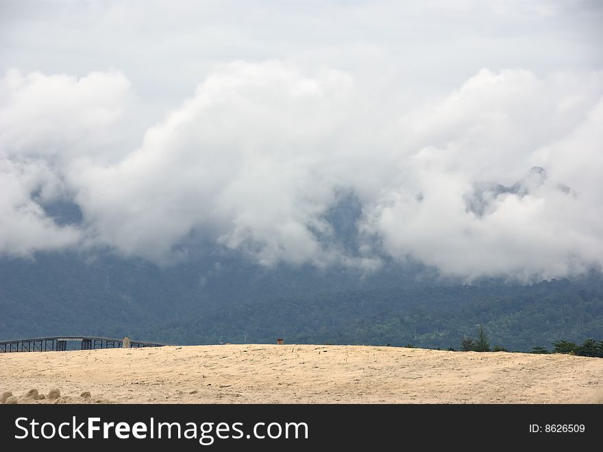 Langkawi beach and clouds on mountains