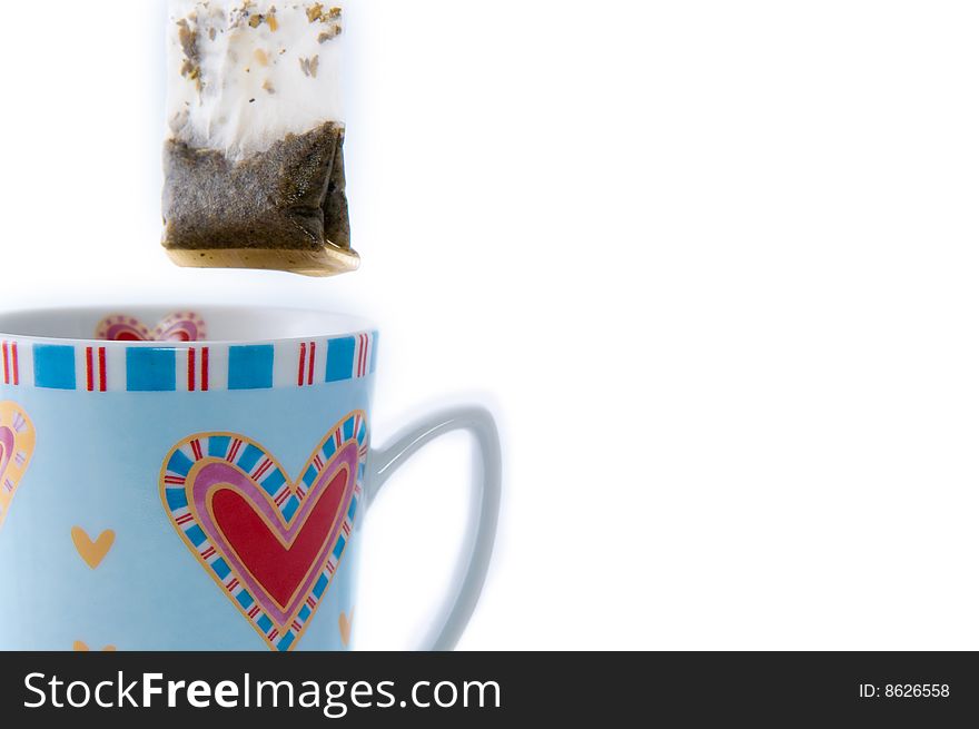 Cup of tea with teabag isolated on white