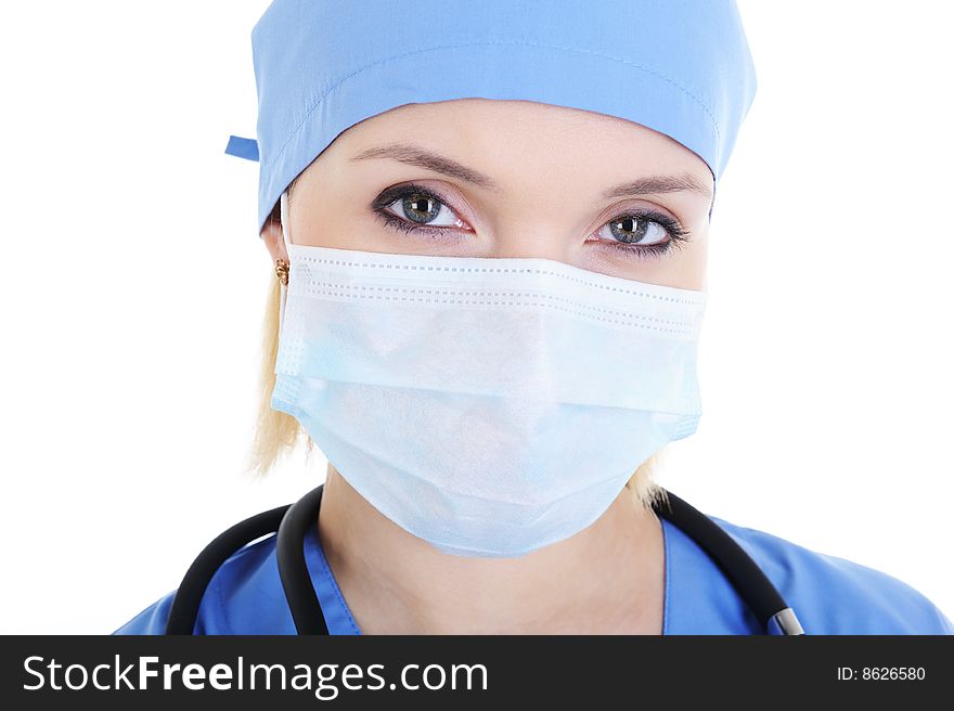 Close-up face of female surgeon in medical mask - isolated on white