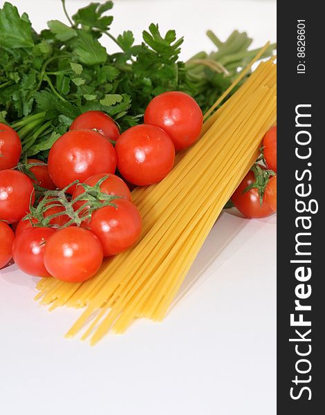 Italian food. Spaghetti, tomatoes and vegetables