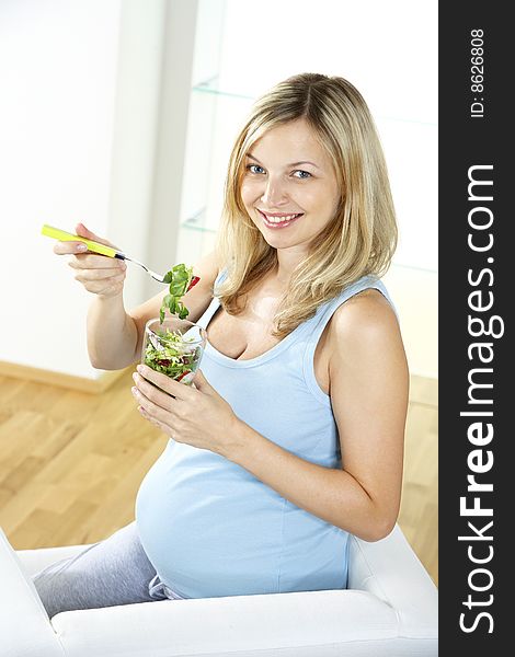 Young Woman Eating Salad