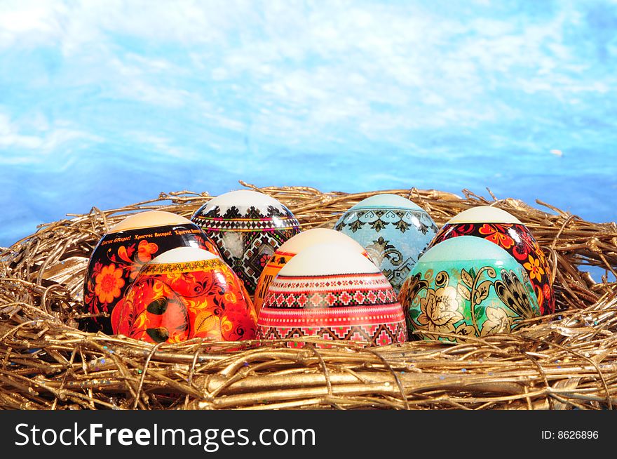 Brush painting eggs in bird's nest