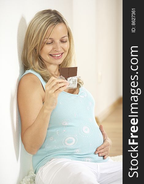 Pregnant woman with chocolate