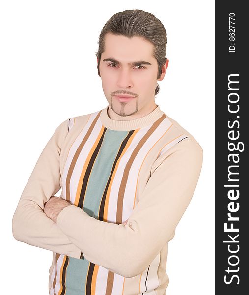 Young serious dark haired caucasian man in striped sweater isolated on white. Young serious dark haired caucasian man in striped sweater isolated on white