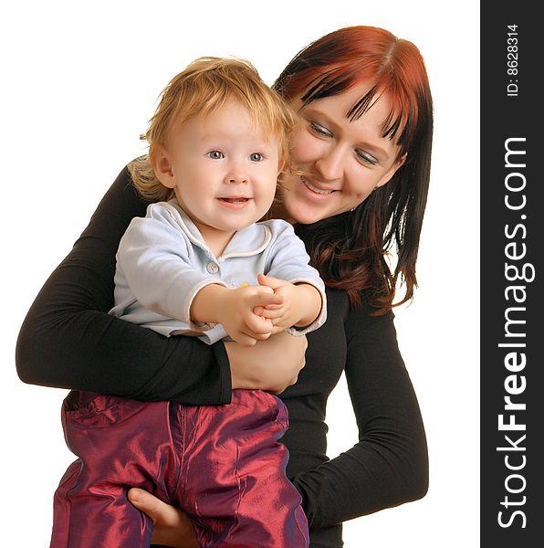 Mother holding a child who looks very happy