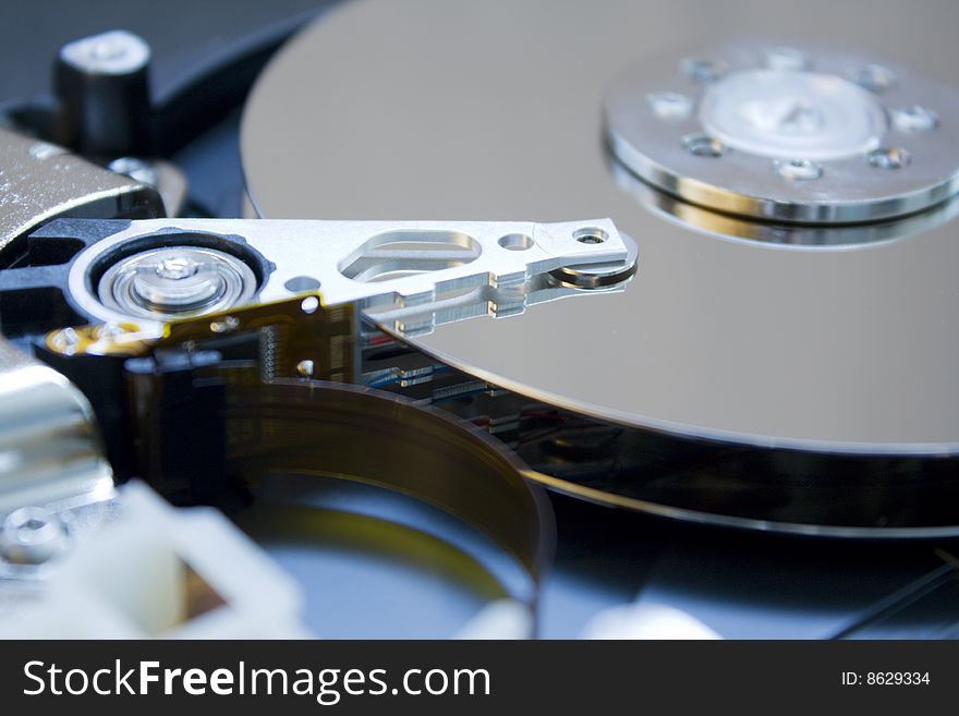 Closeup of the platters and read/write head of a computer hard drive. Closeup of the platters and read/write head of a computer hard drive