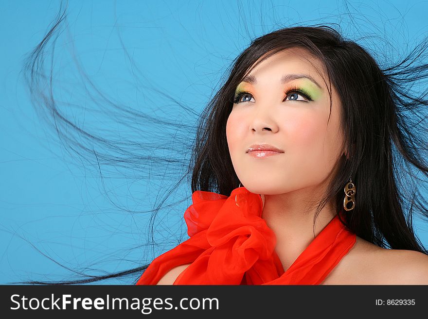 Asian woman on blue background